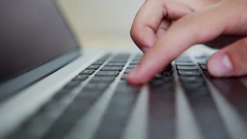 Macro shot of a person fast typing on a laptop keyboard. Man fast typing te.. Stock Footage 339859461