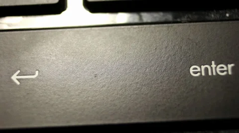 Macro shot of person hitting 'enter' key on keyboard 스톡 동영상 28600749