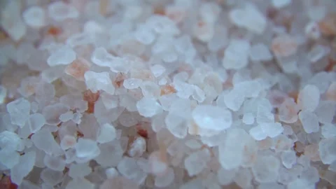 Macro shot of pink Himalayan salt crystals on surface Video stock 333876287