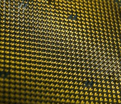 Macro shot of pins in selective focus located on the back of micro processor Stock Photos