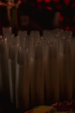 Macro shot of plastic cups for degustation stacked on a table Stock Photos