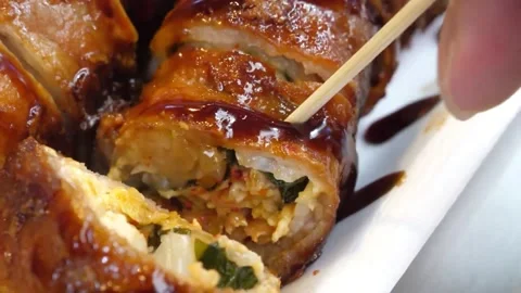 Macro Shot of Pork Belly Rice Roll Stuffed with Spicy Kimchi and Cheese 스톡 동영상 343588110