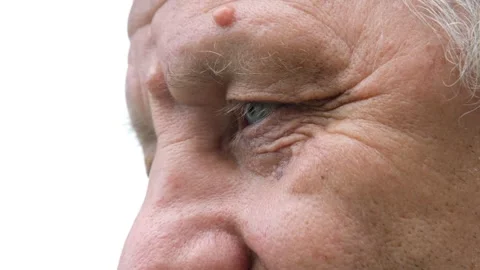 Macro shot of positive senior elderly man face and eyes Stock Footage 132311358