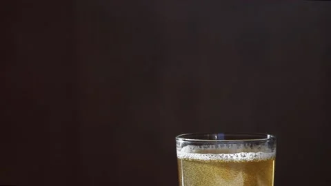 Macro Shot Of Pouring Light Beer Into Glass Stock Footage 143567168