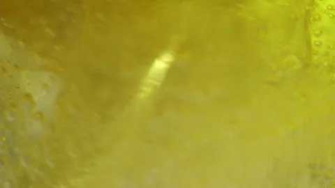 Macro shot of pouring oil Stock-Footage 93311941