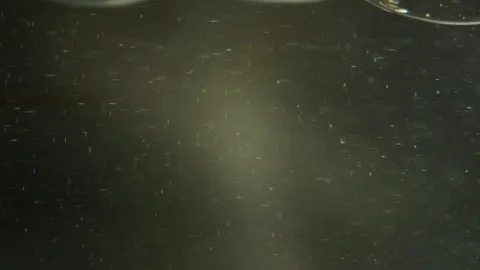 Macro shot of pouring oil Stock Footage 93312094