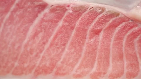 Macro Shot of Premium Bluefin Tuna Otoro (Fatty Tuna Belly) with Rich Marbling Stock Footage 333600515
