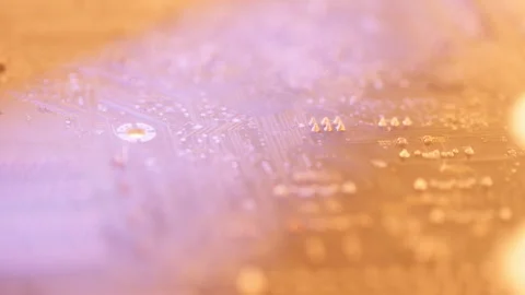 Macro shot of a printed circuit board catching fire from bottom, big flame. Stock Footage 304307306