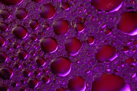 Macro shot of purple bubbles, abstract background. Stock Photos