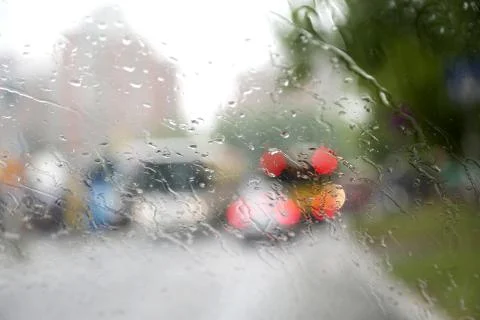 Macro shot of rain drops on drivers window Stock Photos