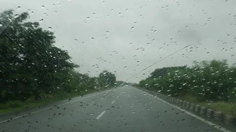 Macro shot of raindrops on windshield, View of water droplets on windshield o Video stock 156954353