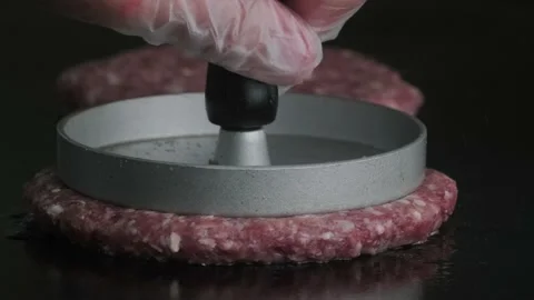 Macro shot of raw burger on grill. 動画素材 140326391
