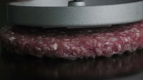 Macro shot of raw burger on grill. Stock Footage 140326689