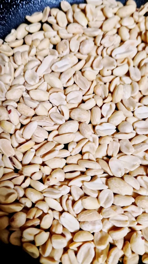 Macro Shot of Raw Shelled Peanuts in a Pan Stock Footage 321462422