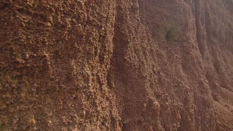 Macro shot of a red clay wall with relief, in Spain Stock Footage 221282389