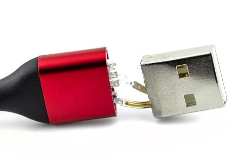 Macro shot of the red damaged end of the USB 2.0 A-Type cable, isolated on a Stock Photos