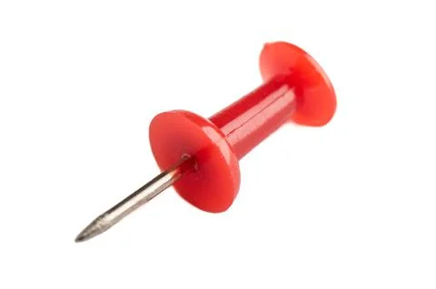 Macro shot of a red pushpin isolated on a white background. Stock Photos
