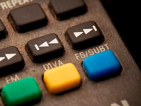 Macro shot of a remote control panel with textured surface and colorful fun.. Stock Photos