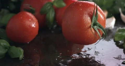 Macro shot of ripe red fresh tomato in the kitchen while cooking with pure water Stock Footage 268984183