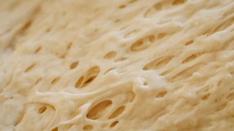 Macro Shot of Rising Bread Dough Stock Footage 129868924