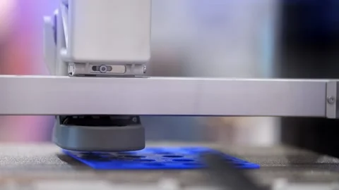 Macro shot of robotic arm scanning blue material Stock Footage 344647668