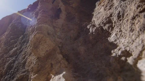 Macro shot of rock relief in the sunlight along a climbing wall, Margalef, Spain Stock Footage 289294916