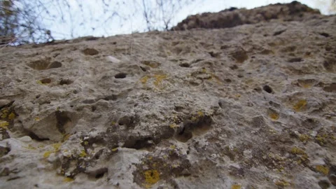 Macro shot of a rock with small holes like drops of water, Margalef, Spain Stock Footage 289294857