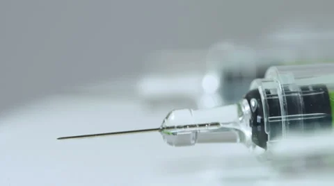 Macro shot of rotating syringes. Stock Footage 66382860