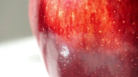 Macro shot rotation red apple with water drops Stock Footage 61455306