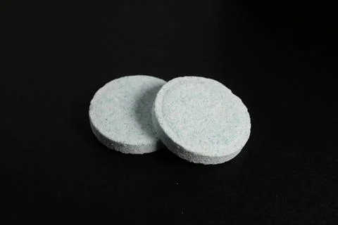 Macro Shot Of Round Effervescent Multi Vitamin Tablets On Black Backgr 스톡 사진