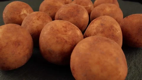 Macro shot of round marzipan brown. A mixture of floured almonds and sugar syrup Stock Footage 165025074