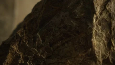 Macro shot of rugged cliff rock with sharp formations in sunlight Stock Footage 313180354