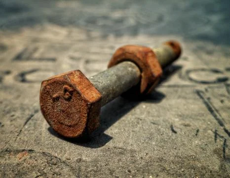 Macro shot of rustic and corroded isolated nut and bolt Stock Photos