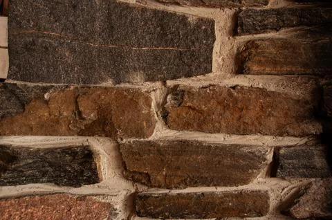 A macro shot of a rustic stone and mortar wall Stock Photos