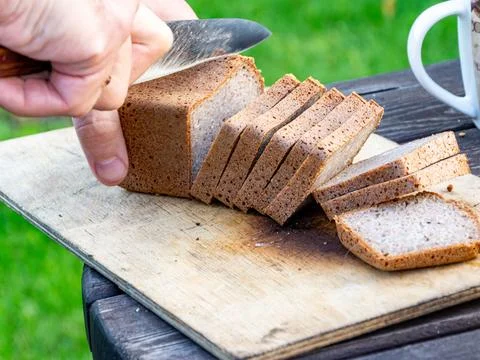 Macro shot of rye bread slicing showing dense crumb and dark crust Stock Photos