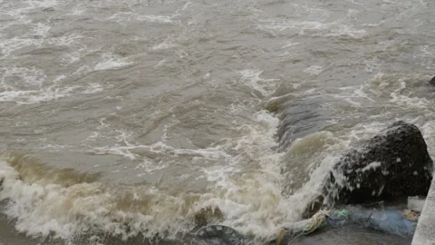 Macro shot of sea waves striking sea shore Video stock 191373133