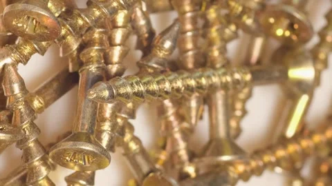 Macro shot of self-tapping screws in a furniture workshop. Use of fasteners when Stock Footage 250113337