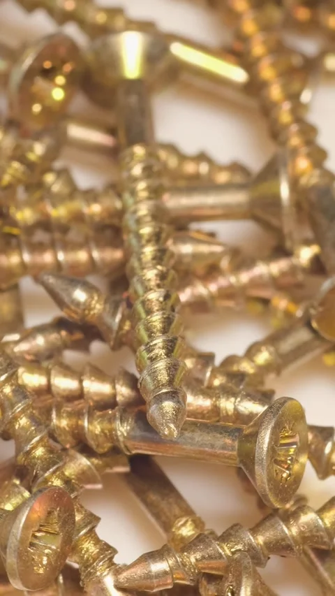 Macro shot of self-tapping screws in a furniture workshop. Use of fasteners when Vídeo Stock 250386693