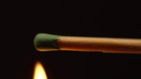Macro shot set fire to match in slow motion on a black background. Stock Footage 108985672