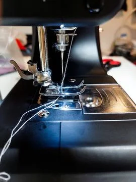 Macro Shot of Sewing Machine Needle and Thread Stock Photos