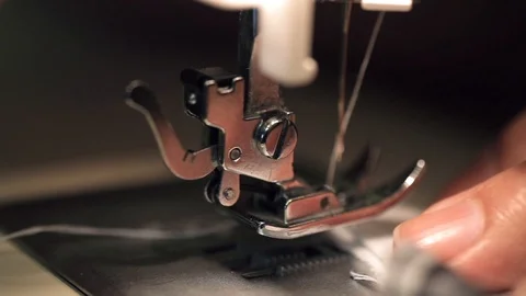 Macro shot of sewing machine in working process, seamstress sews clothes from 스톡 동영상 100982948