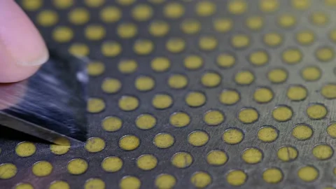 Macro shot of sharpening a chisel on a diamond sharpener Stock Footage 139015694