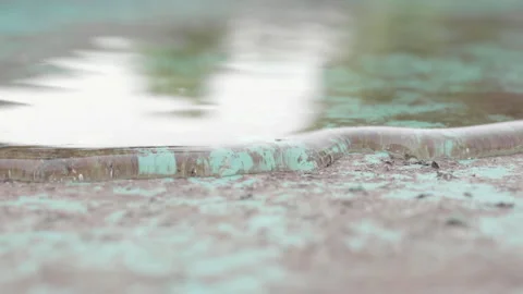 Macro shot of sheet of water running slowly Video stock 137677679