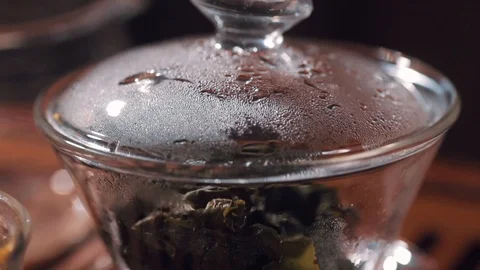 Macro shot of Сhinese tea ceremony set with glass utensil Stock Footage 100337053