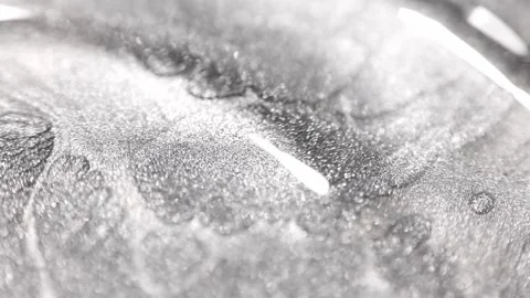Macro shot of silver platinum paint with specialized sandy texture flowing Stock Footage 327605567
