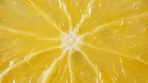 Macro Shot of Slice Orange Fruit and Rotate. Closeup Fresh Citrus Orange 動画素材 154374395