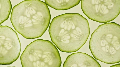 Macro Shot of Sliced Cucumber Fruit Slices and Rotate. Cucumber Pattern. Healthy Stock Footage 154372188