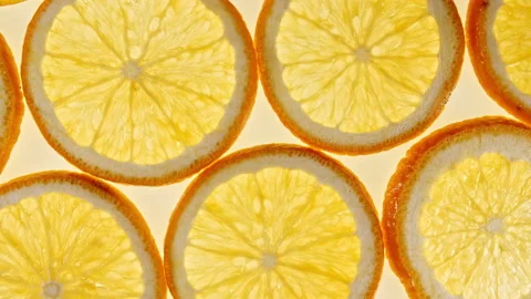 Macro Shot of Sliced Orange Fruit Slices and Rotate. Orange Fruit Pattern Stock Footage 155599774