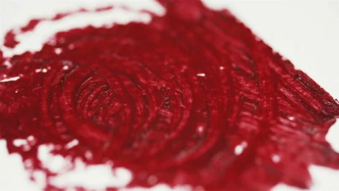 Macro shot of smears of red lipstick on a white background. Traces of lipstick.	 Stock Footage 113670873