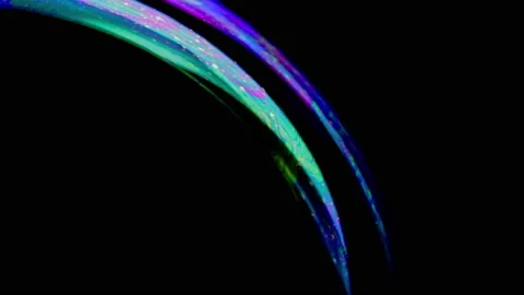 Macro shot of soap bubble with an iridescent multicolored surface Stock Footage 146527759